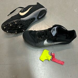 Nike track shoes with spikes and bag